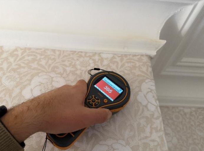 High readings to chimney breast in middle bedroom